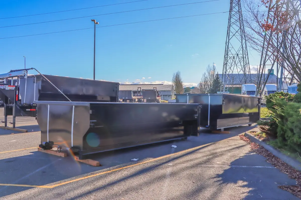 Roll-off dumpster ready for waste disposal at job site for Demolition Dumpster Rental in Devils Lake